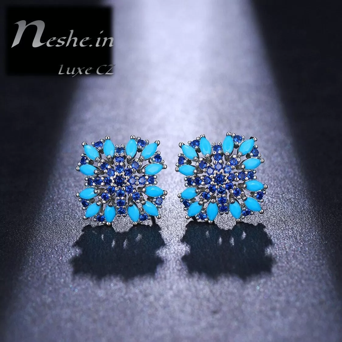 CZ Blue floral emitting shape stud earring